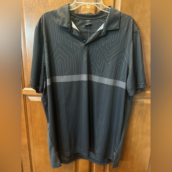 Oakley Other - SOLD ON XPOST 🆕 Oakley Black Polo with Geometric Design. XL.
